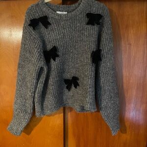 Lush Gray Sweater with Black Bows and Chunky Knit